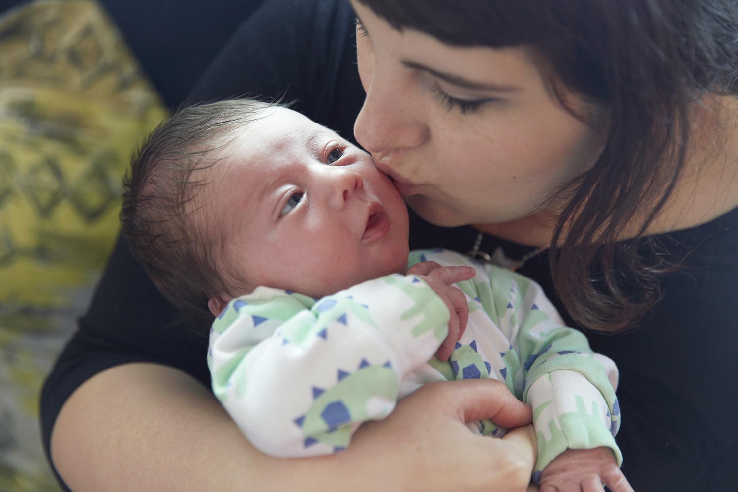 A photograph of Charlotte and her baby son taken by Natalie J Weddings Photography.