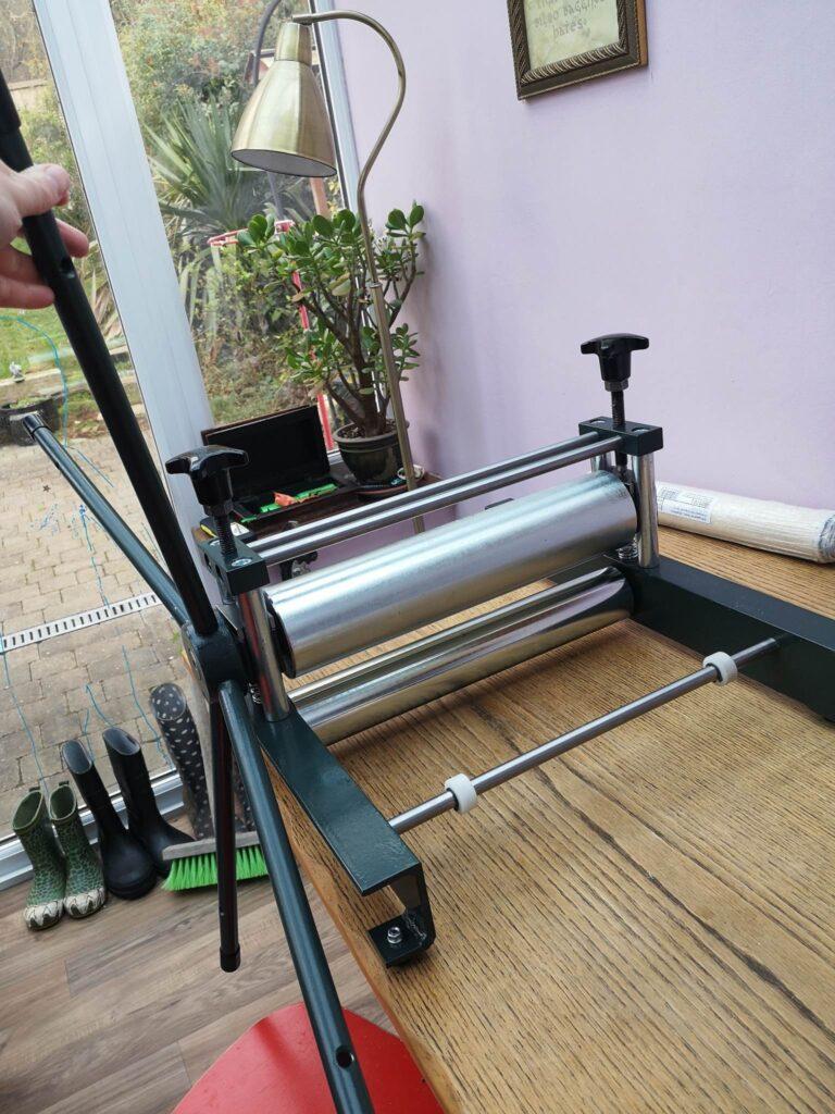A photograph of a printing press being set up