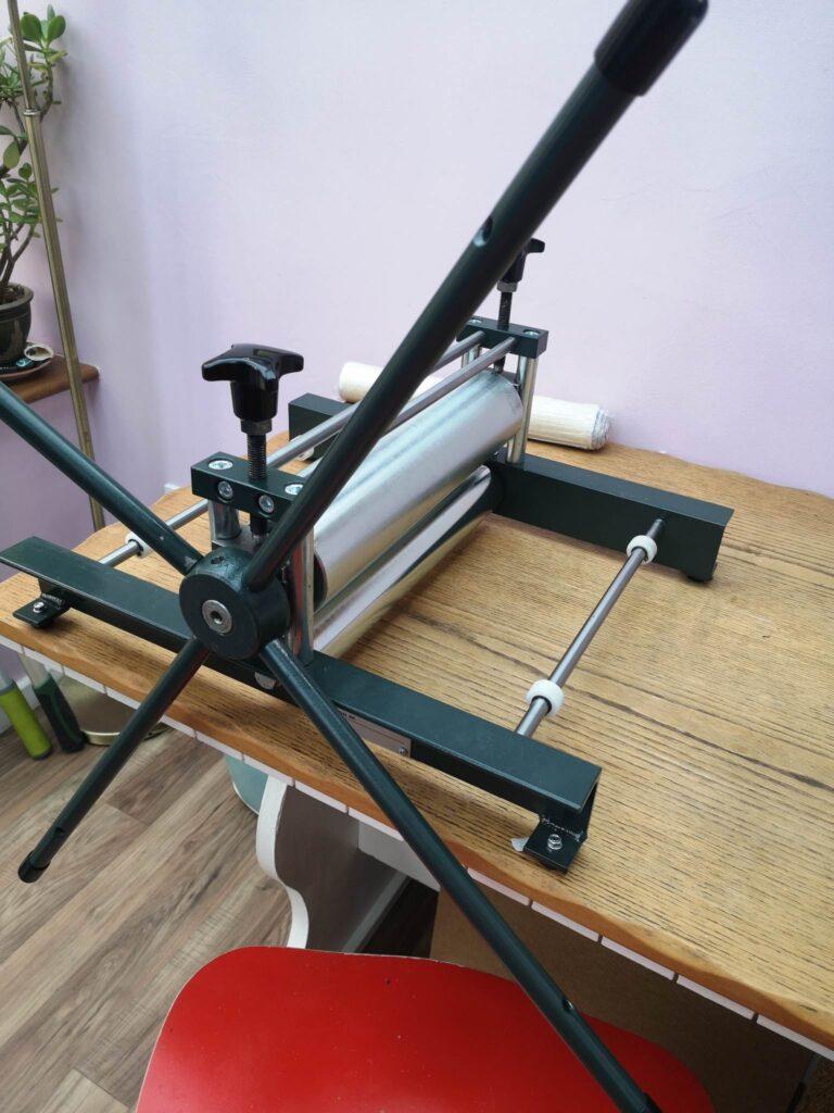 A photograph of a printing press being set up 