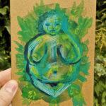 A fat bodied femme bodied nature goddess type figure created in mixed media painting in shades of blue and green